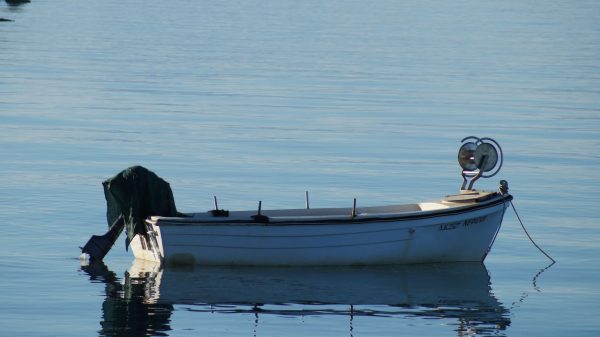 fishing boat calm lake