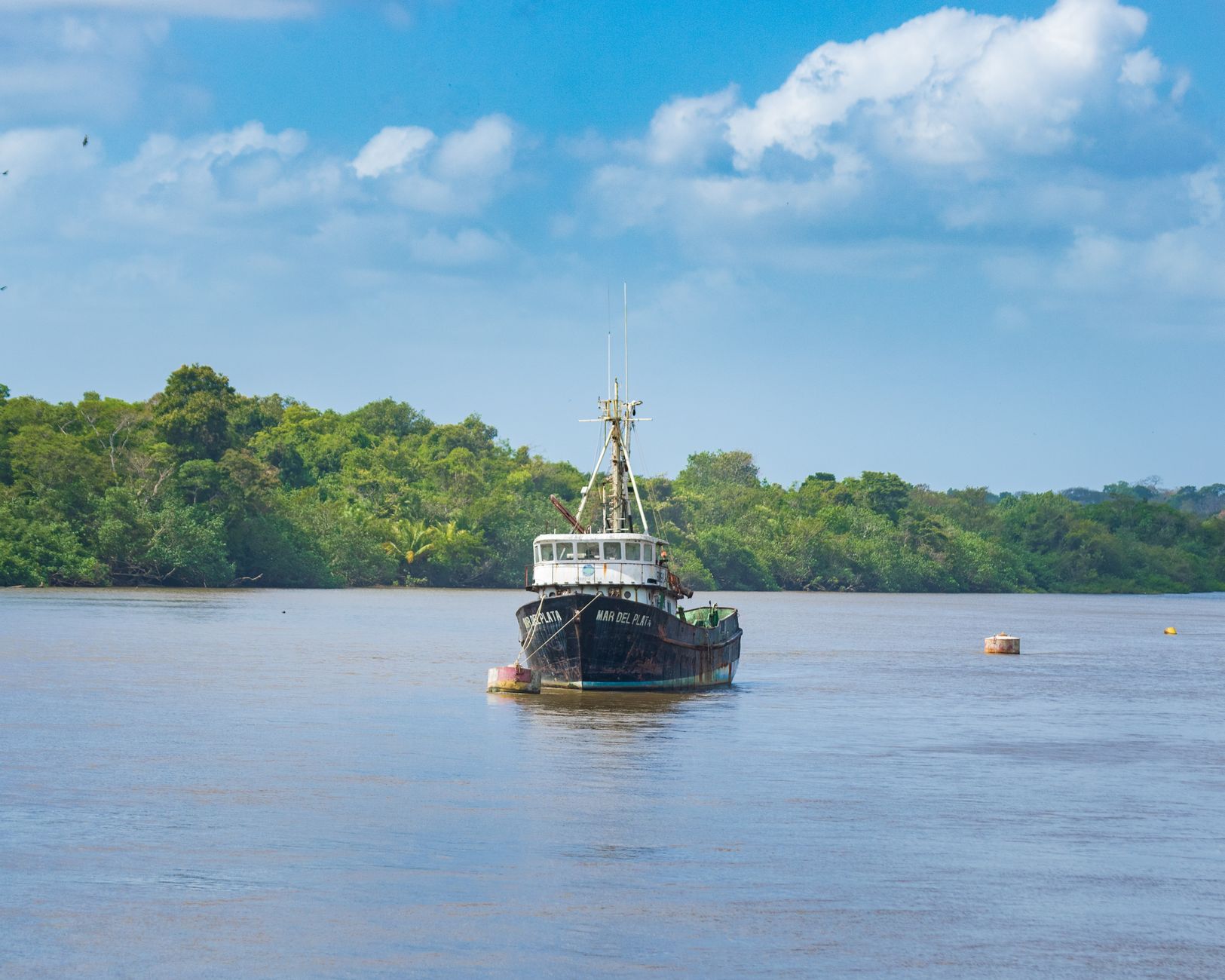 boat navigating wide river