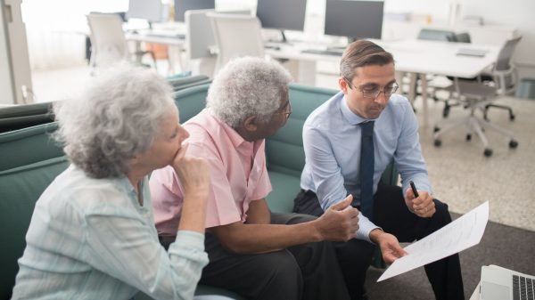 Senior couple meeting with financial advisor in Ohio to discuss whole life insurance and retirement income