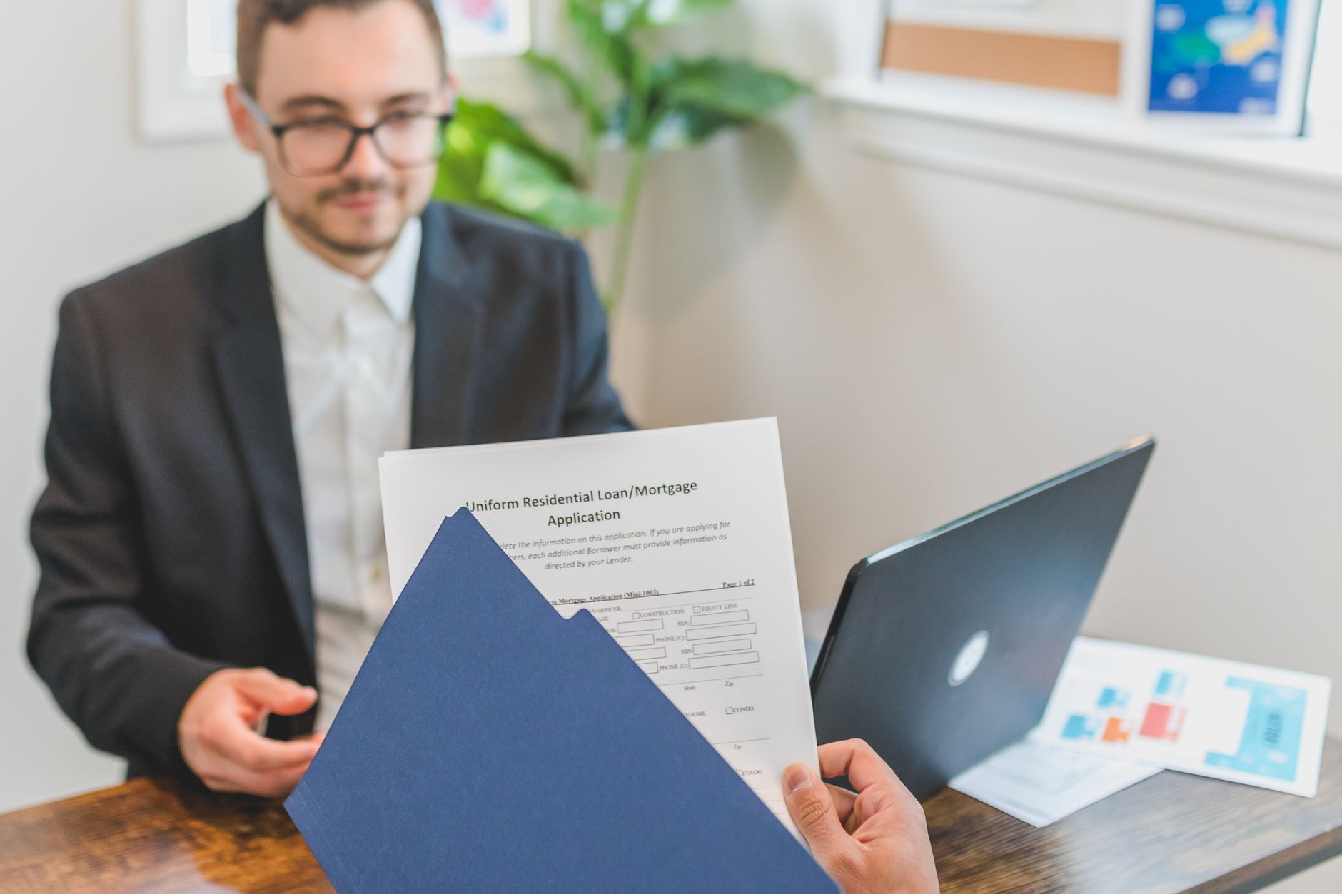Mortgage lender reviewing flood insurance requirement documents