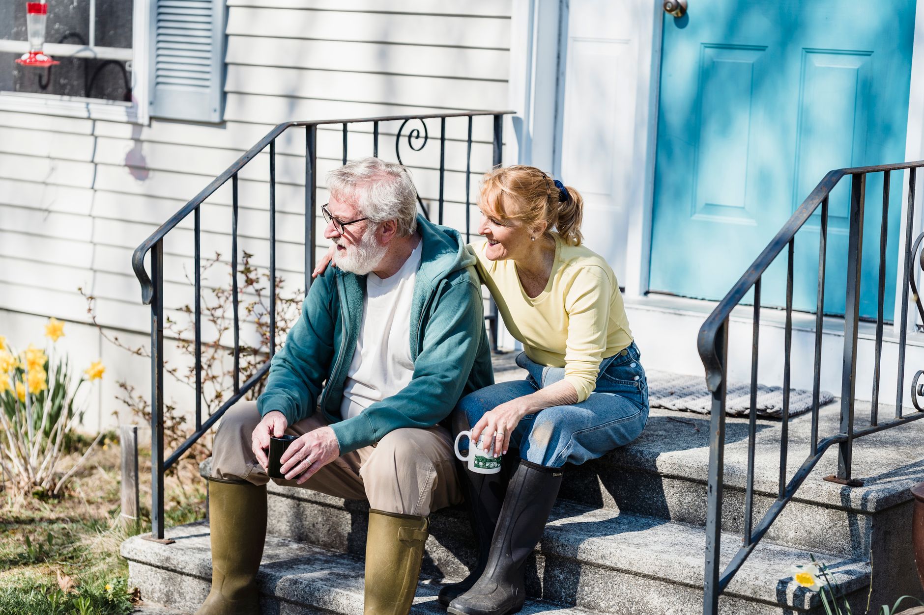 Retired Ohio couple standing outside their home