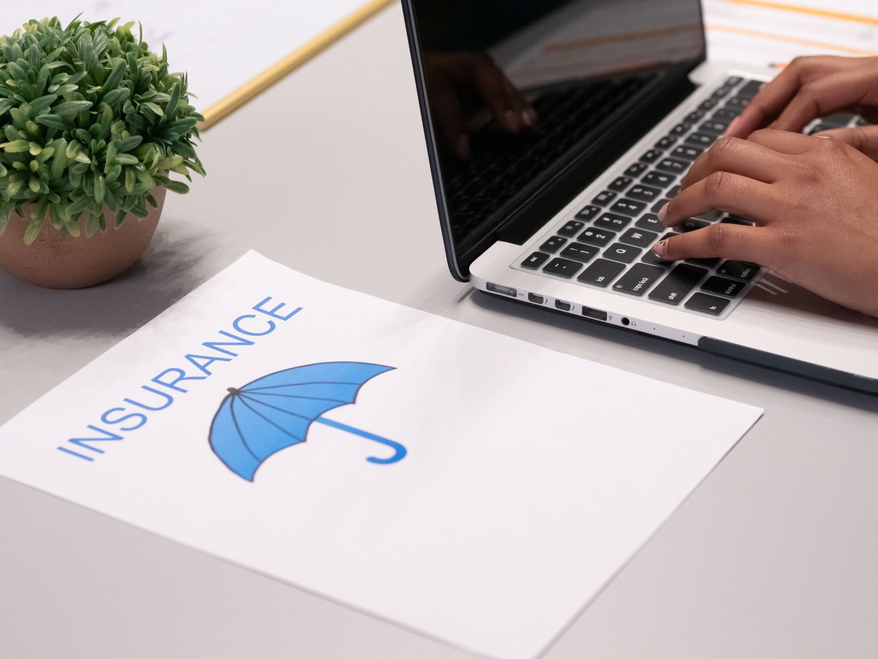 Comparing Ohio insurance quotes on laptop screen
