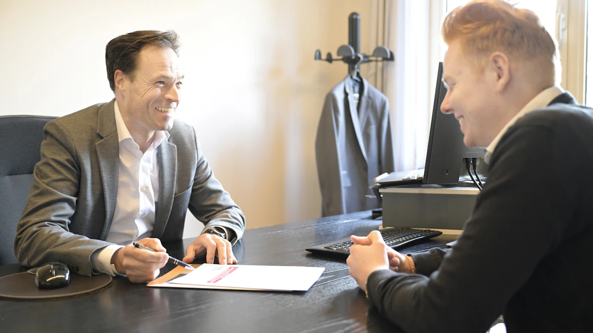 Insurance agent reviewing auto policy with client in Portsmouth Ohio State Farm office