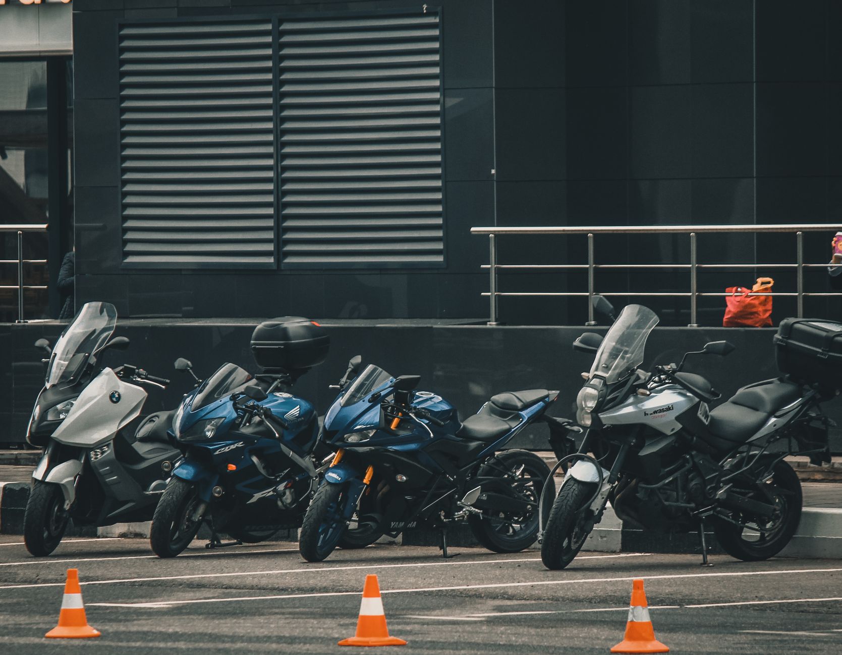 two motorcycles parked comparison