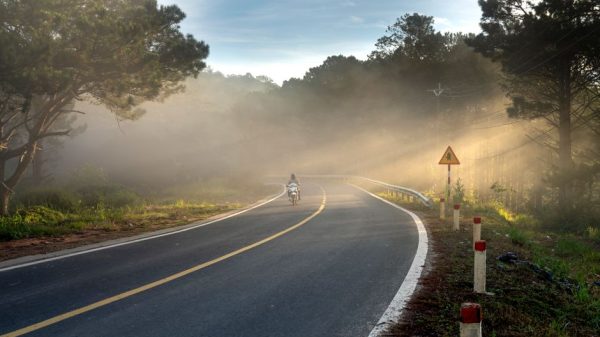 Motorcycle rider on Ohio highway countryside road