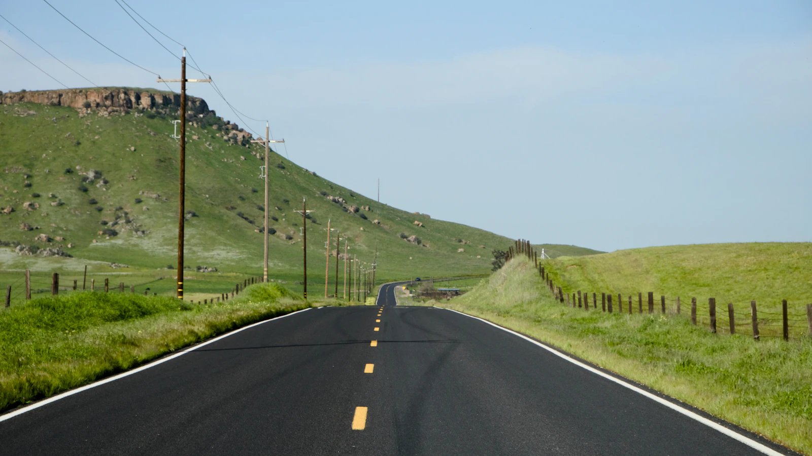 Motorcycle rider on Ohio rural road — state motorcycle insurance requirements and coverage guide
