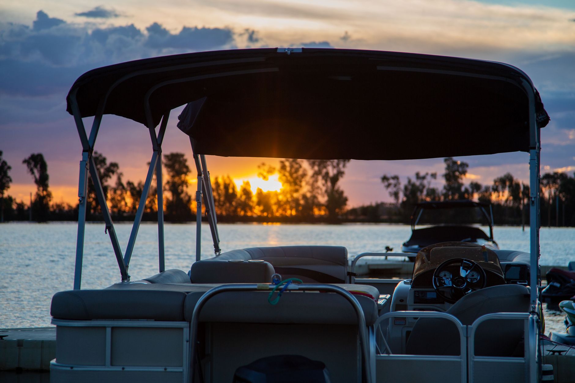 Pontoon boat on Ohio lake at sunset
