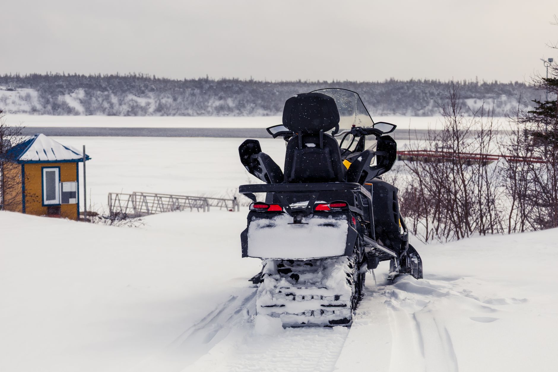 Snowmobile rider crossing frozen Ohio lake