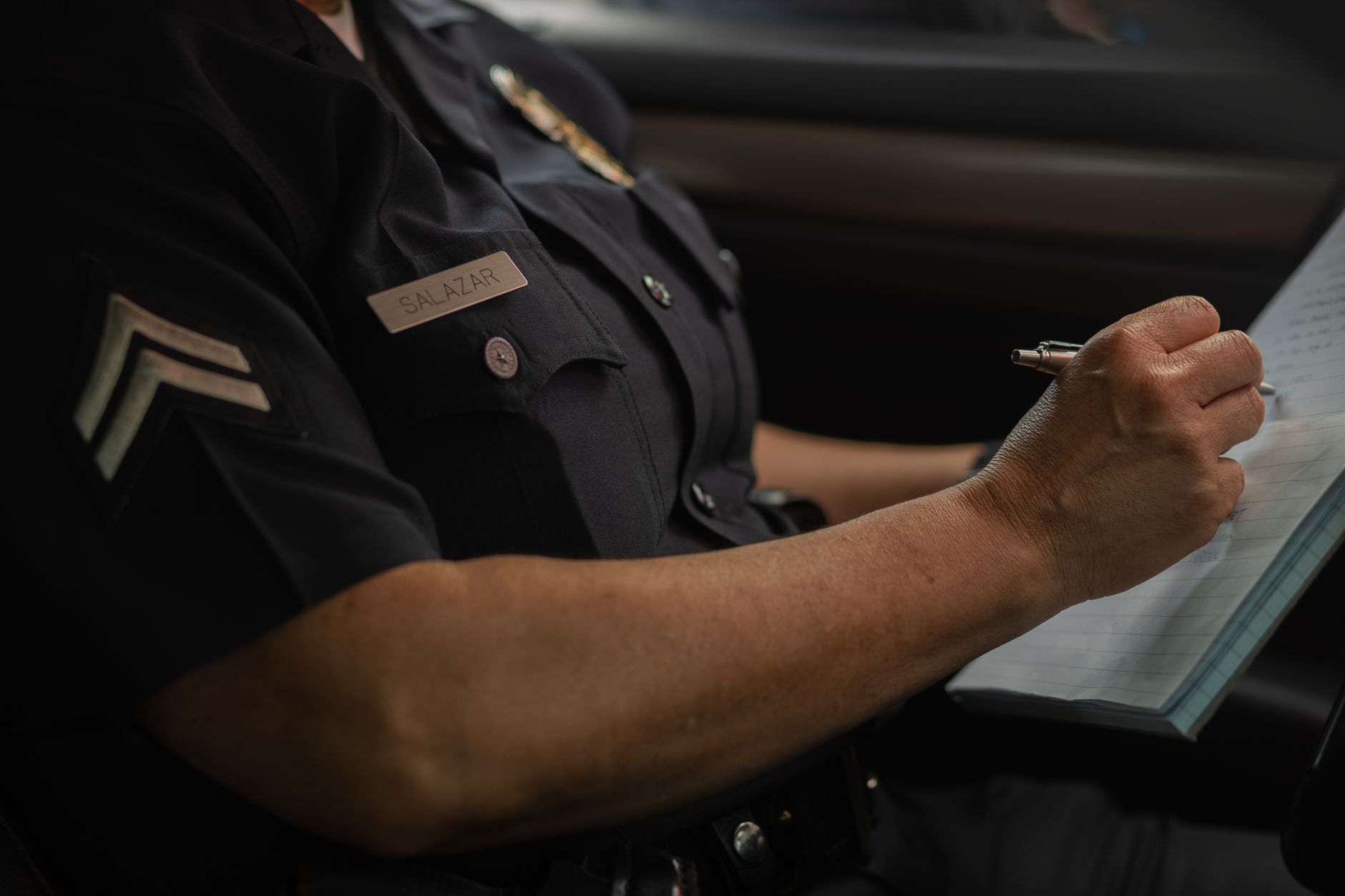 Police officer writing accident report in Ohio