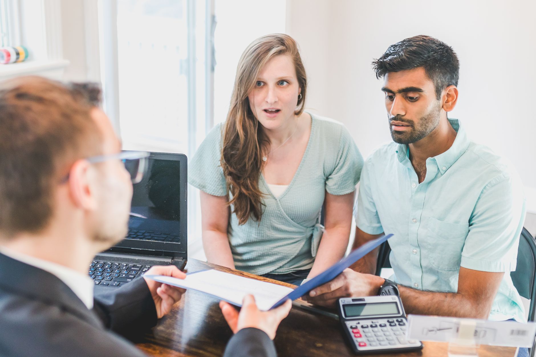 Ohio couple meeting with financial advisor about insurance