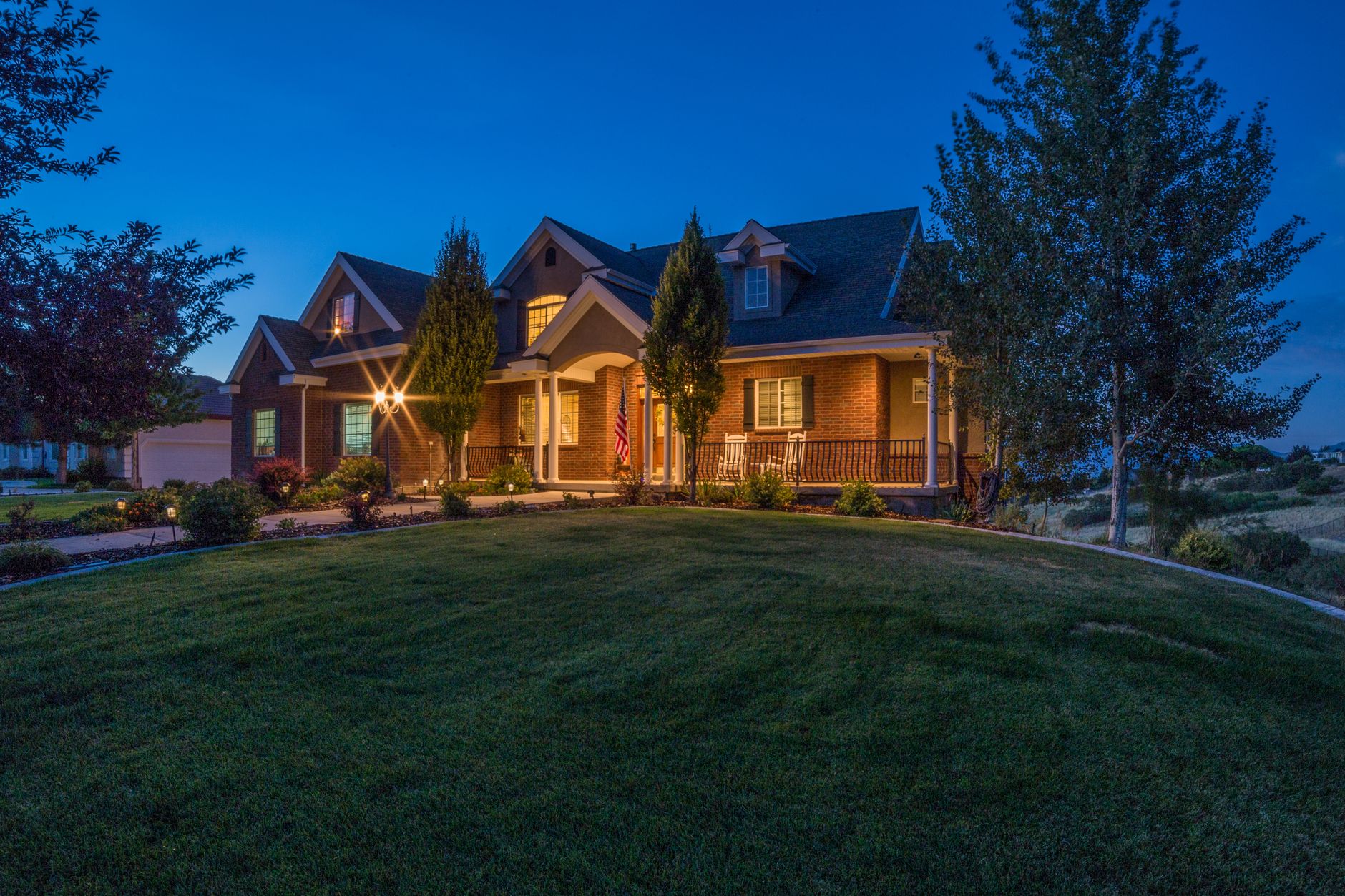 A front porch lit at night