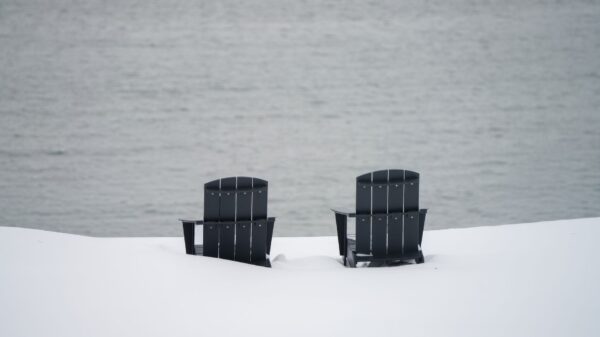 Best adirondack chair: a pair of adirondack chairs facing a lake