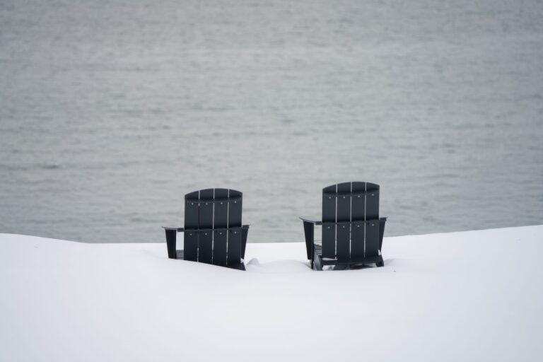 Best adirondack chair: a pair of adirondack chairs facing a lake