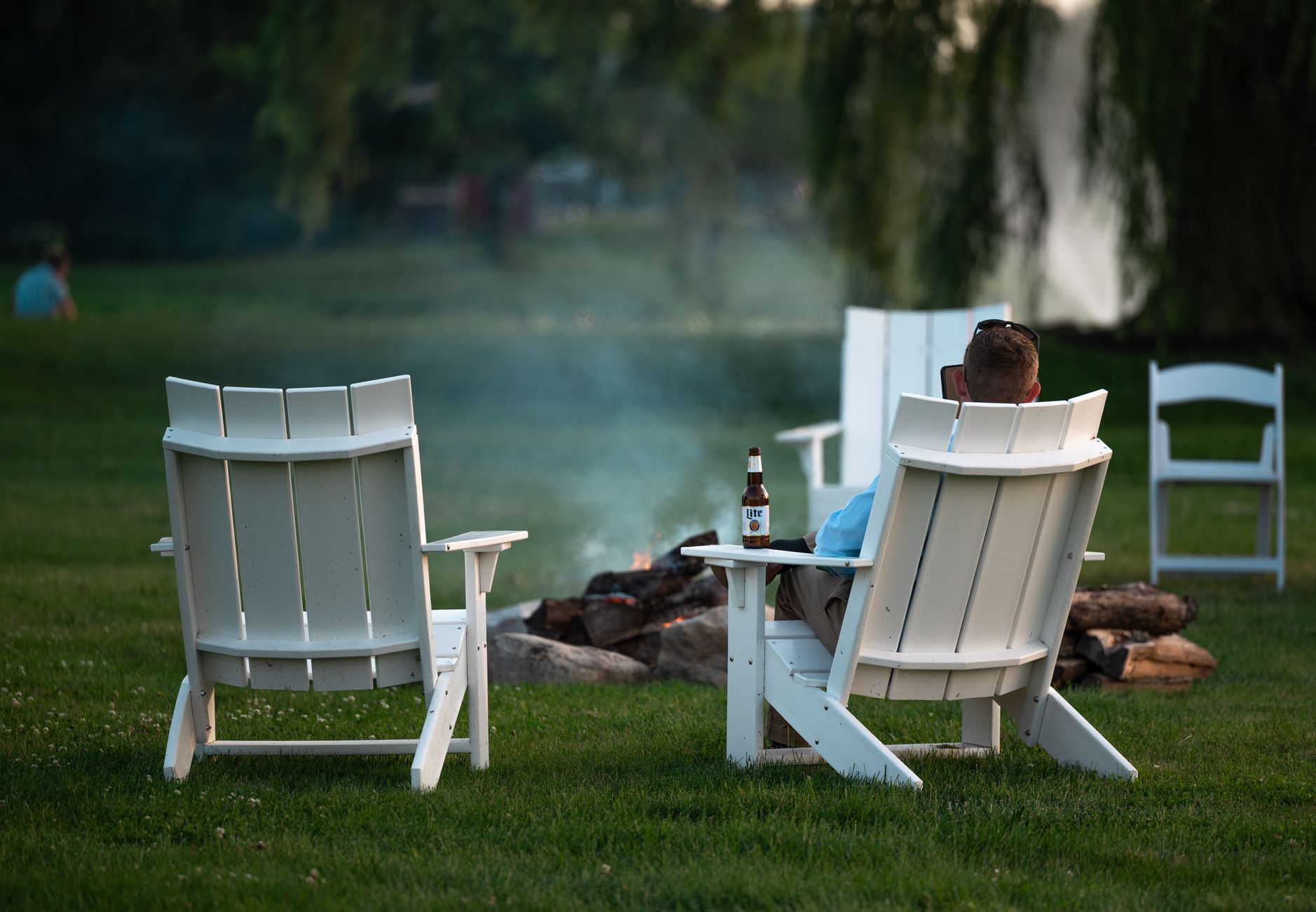 A backyard fire pit in the evening