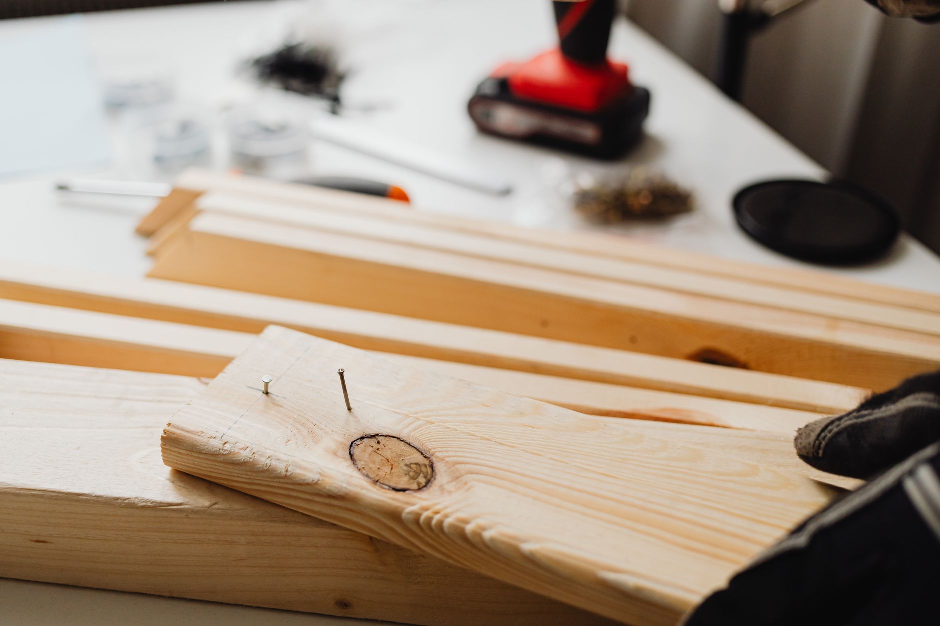 Lumber with nail holes on a workbench