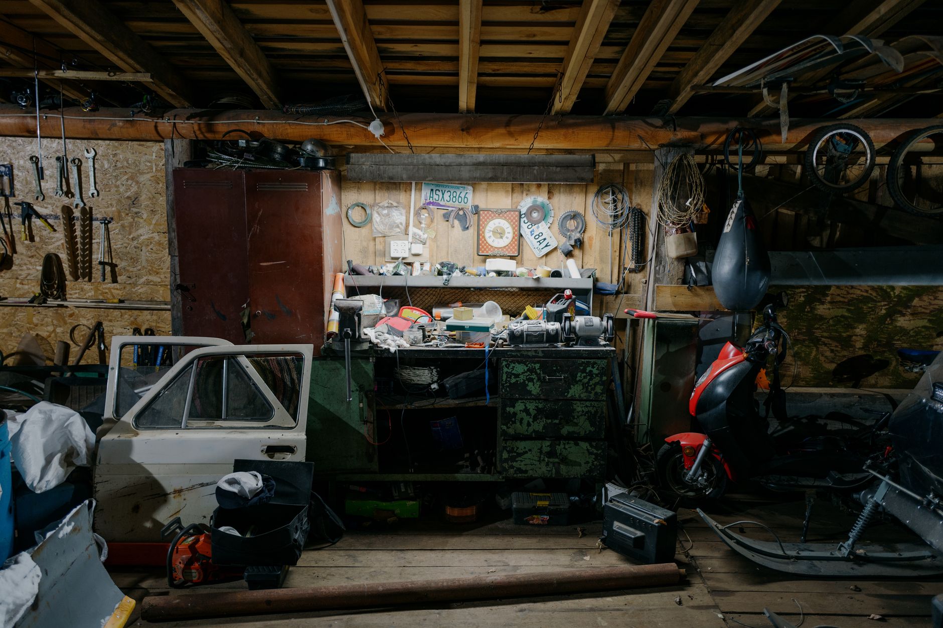 A cluttered garage workshop with tools