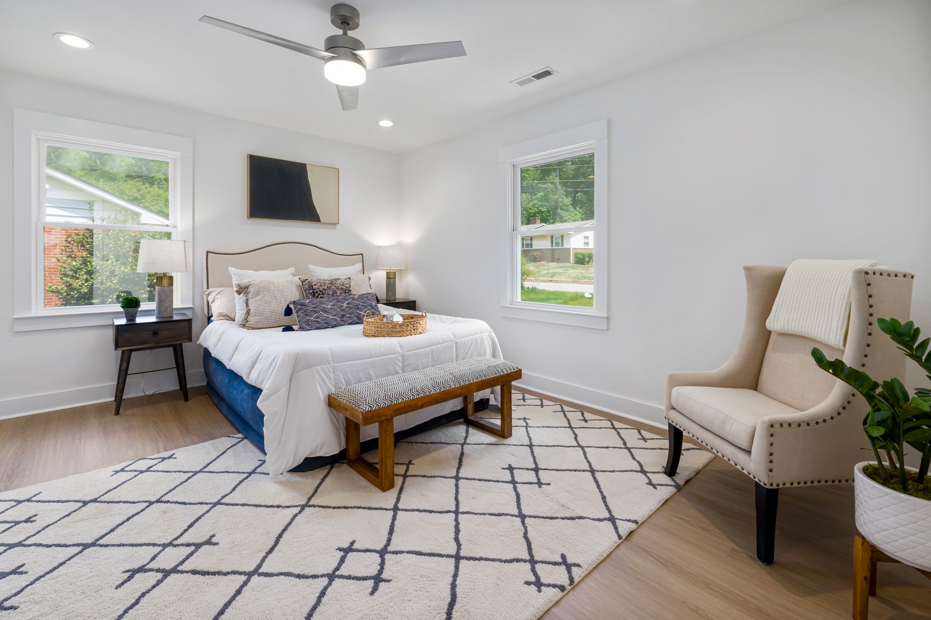 A rug beside a bed in a bedroom