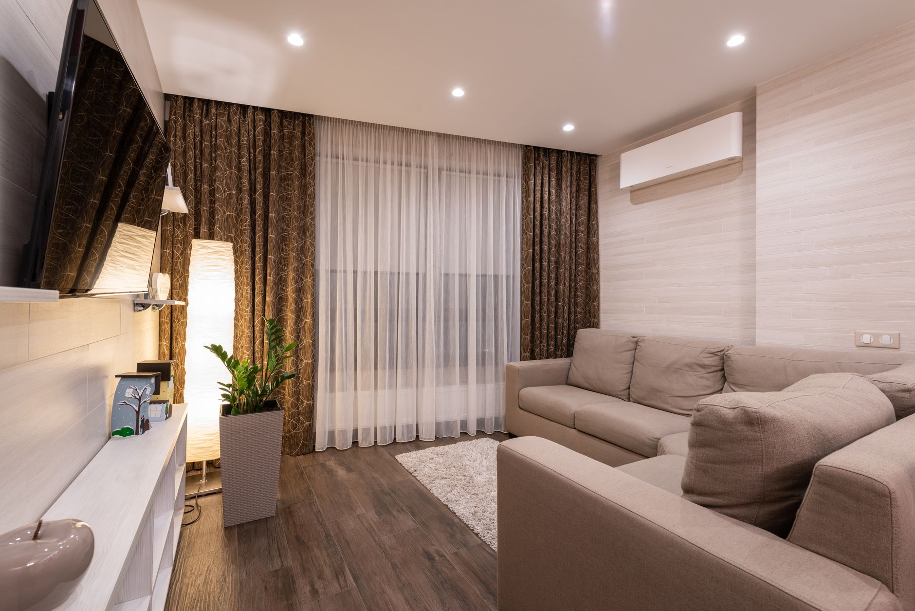 A cozy living room with a rug on the floor