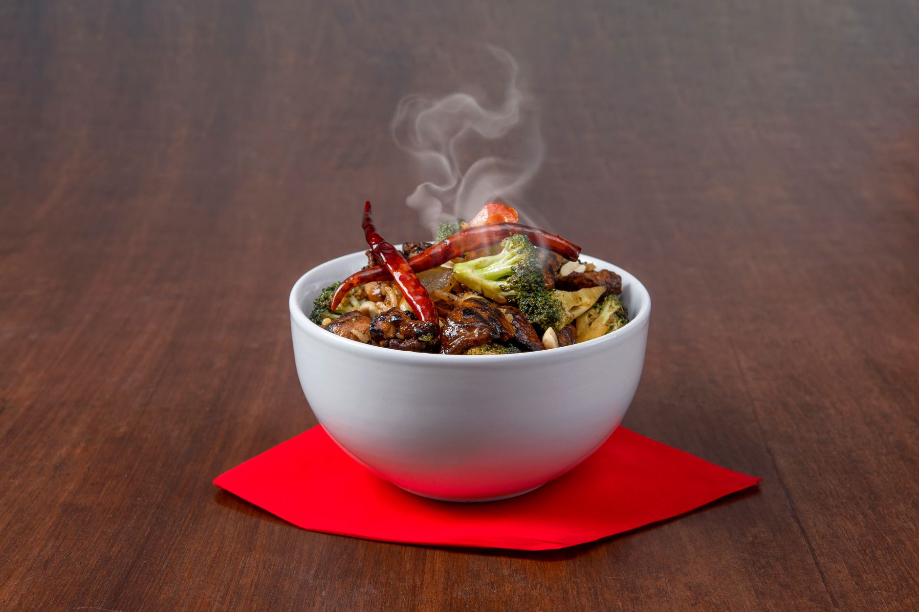 A steaming bowl of stir-fried vegetables