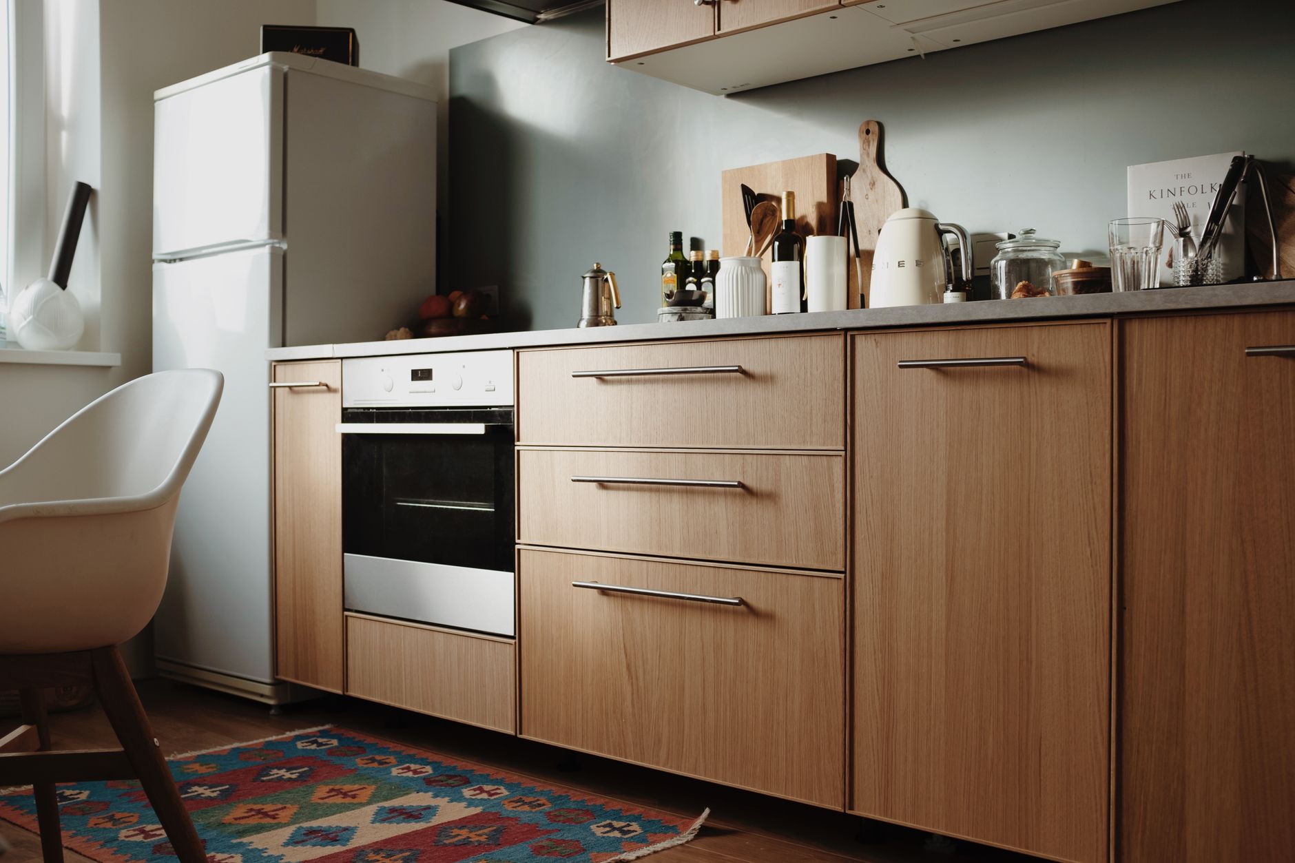A compact kitchen with a white refrigerator