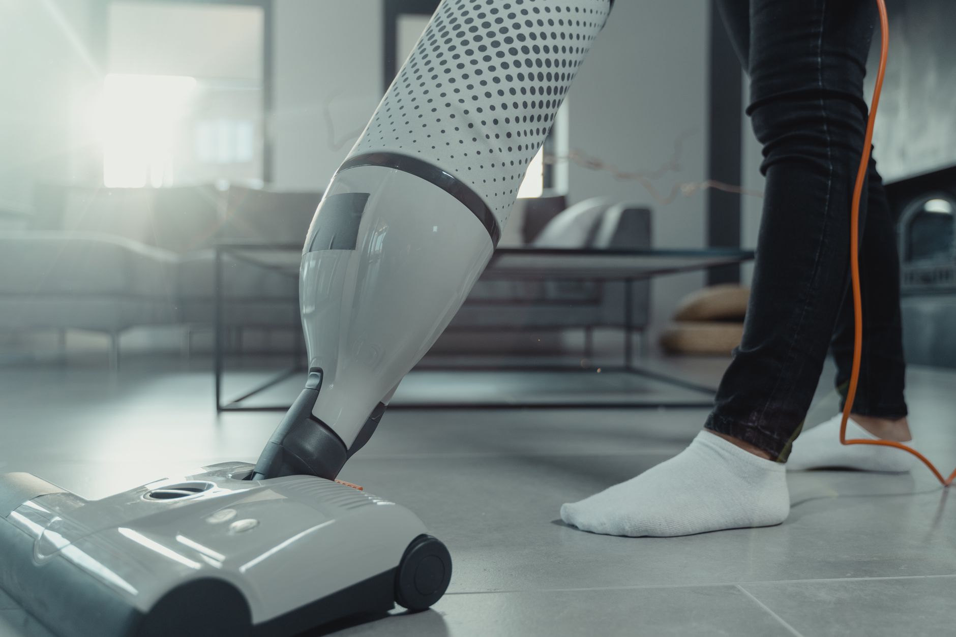 Vacuuming a floor with an upright vacuum