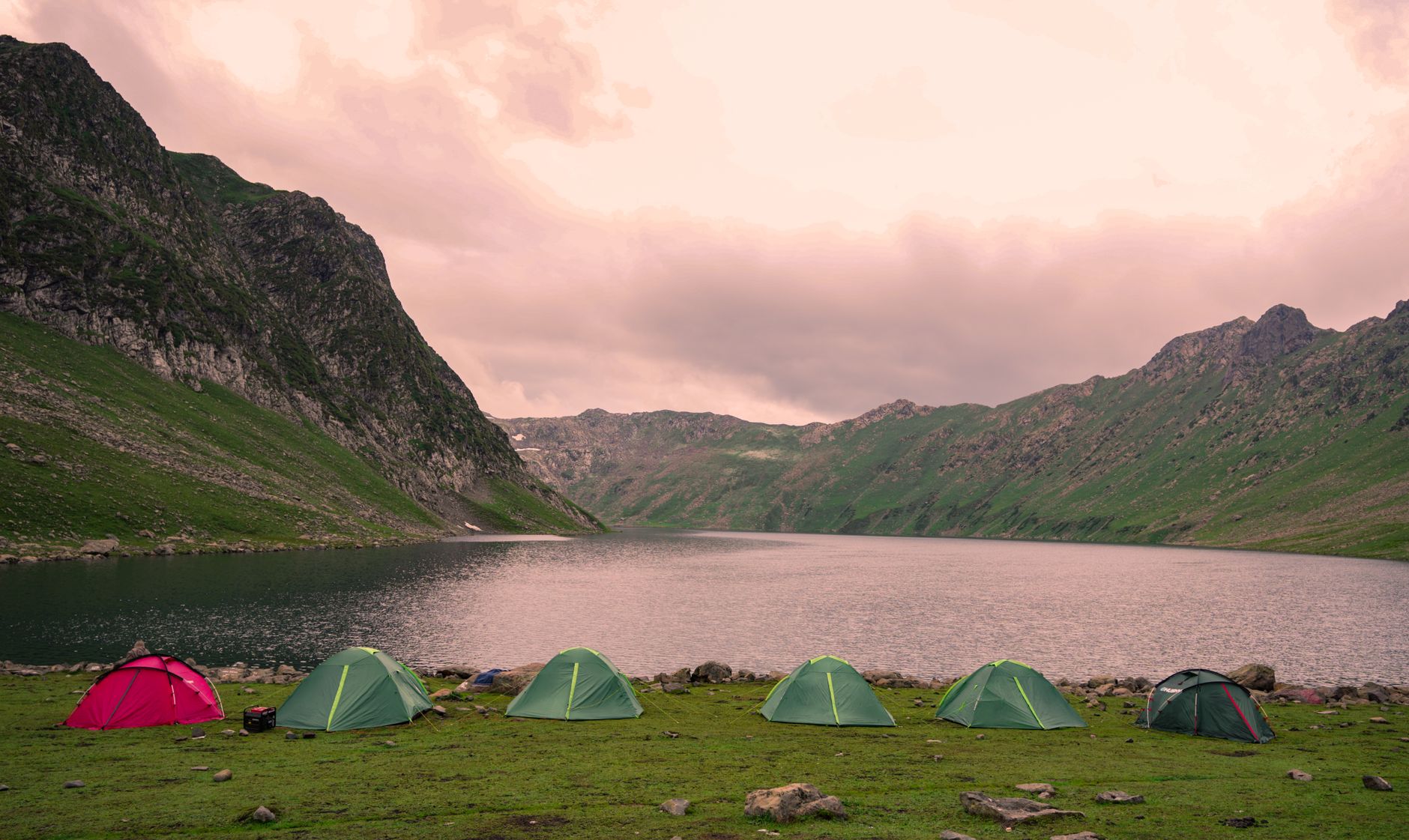 Tents pitched beside a mountain lake