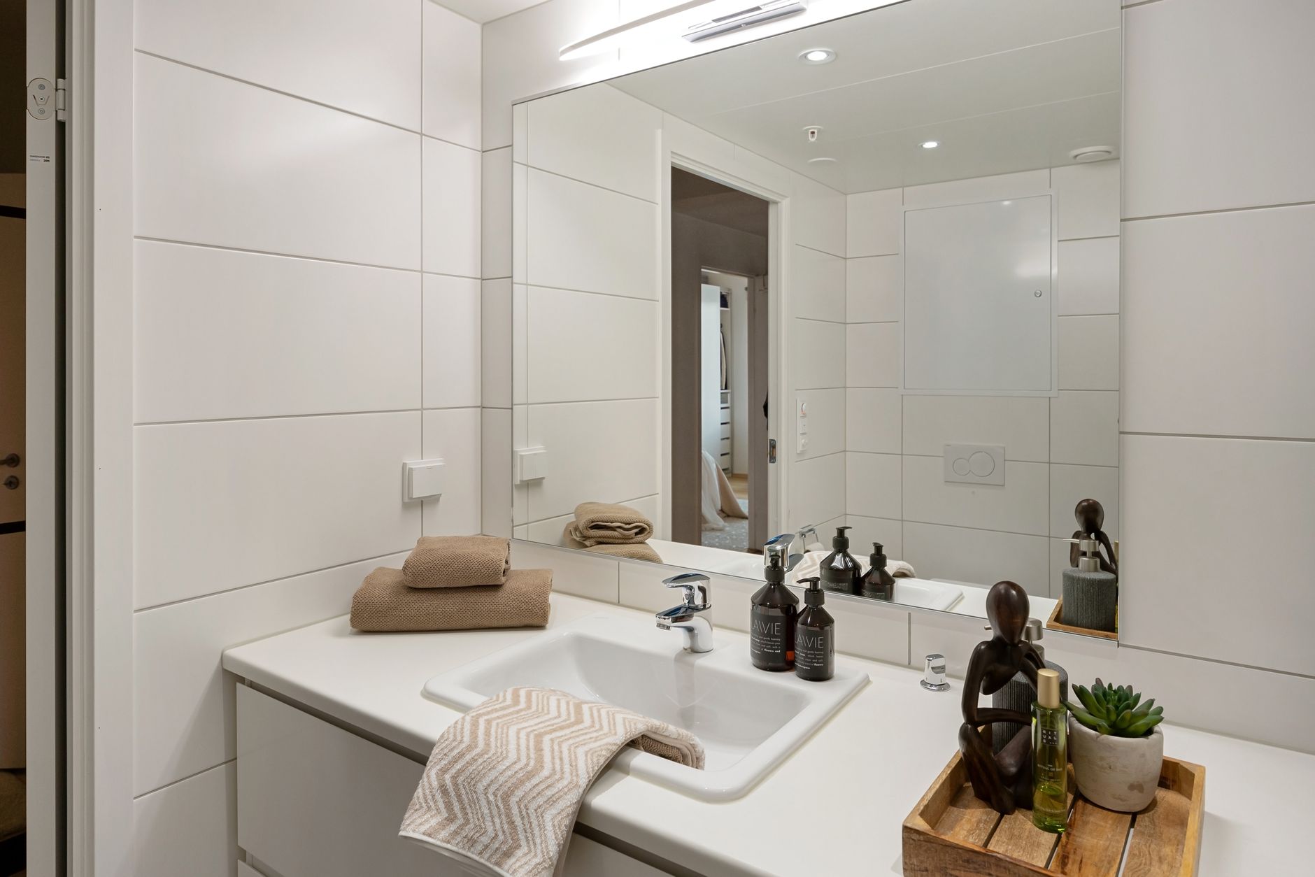 Best bath towels: folded towels by a bathroom sink