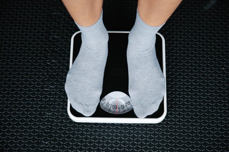 Best bathroom scale: feet in socks on a dial scale