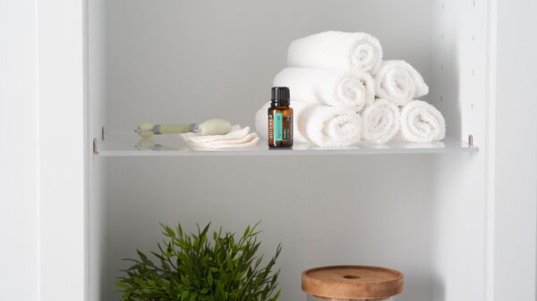 Best bathroom shelf: folded towels and toiletries on a bathroom shelf