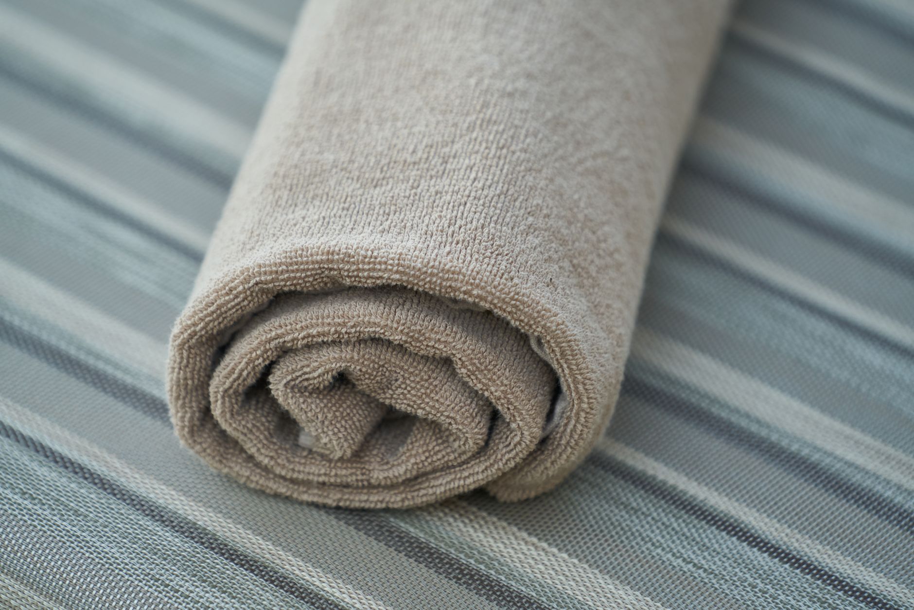 Rolled bath towels ready to store