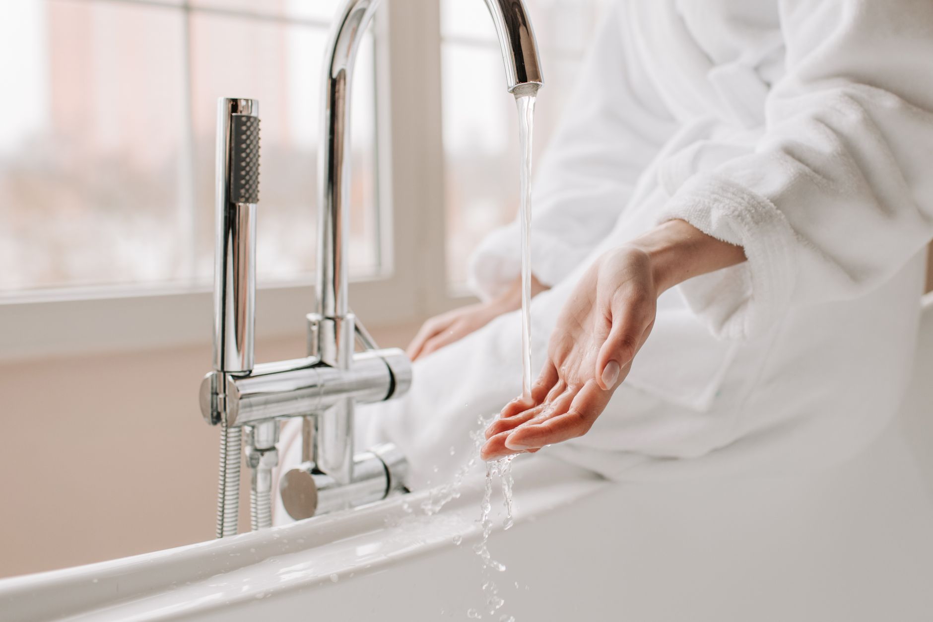 Water running from a tub filler faucet