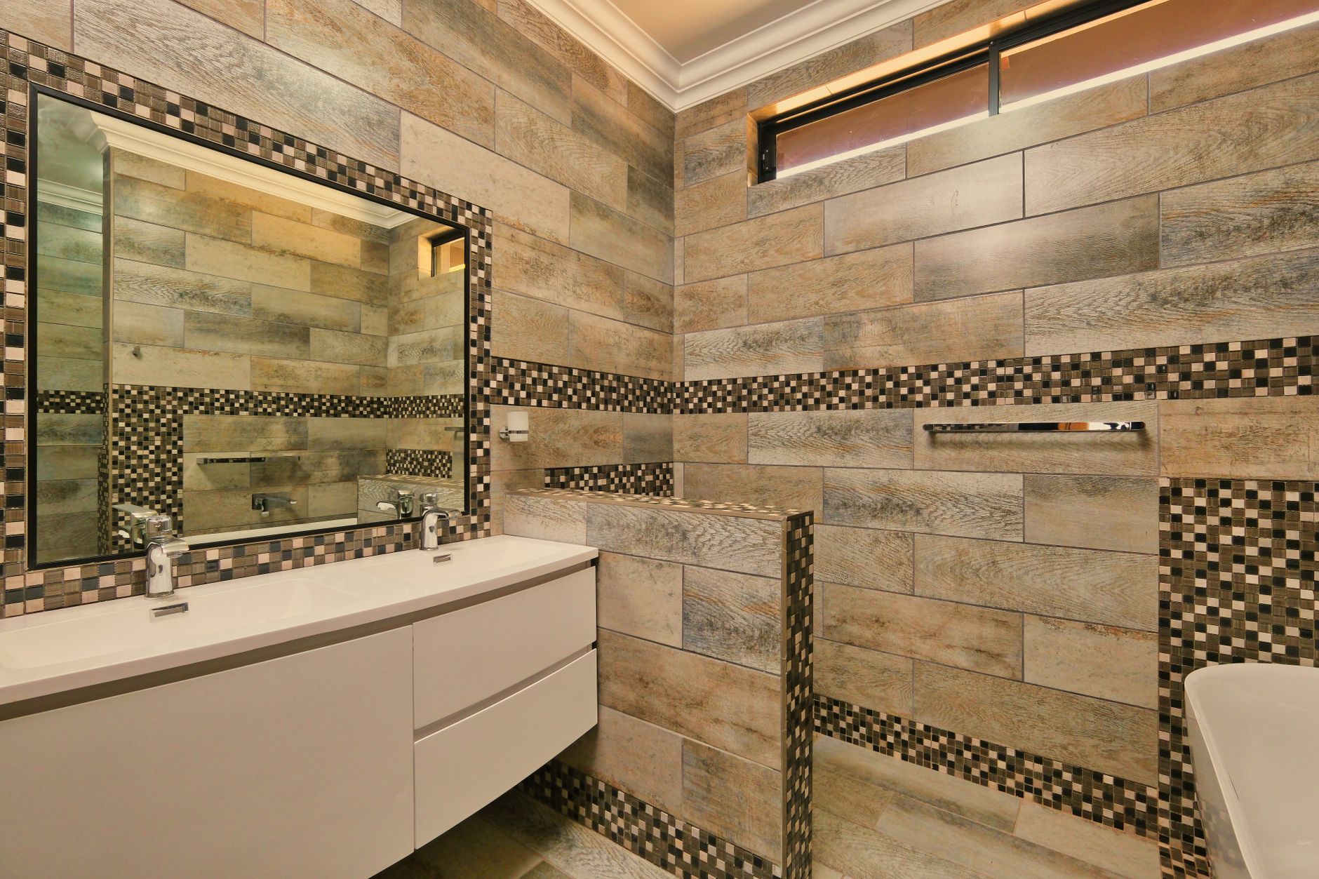 A bathroom with wood-look tile walls