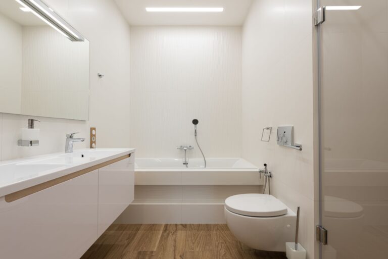 Best bathtub scrubber: a bright white bathroom with a tub