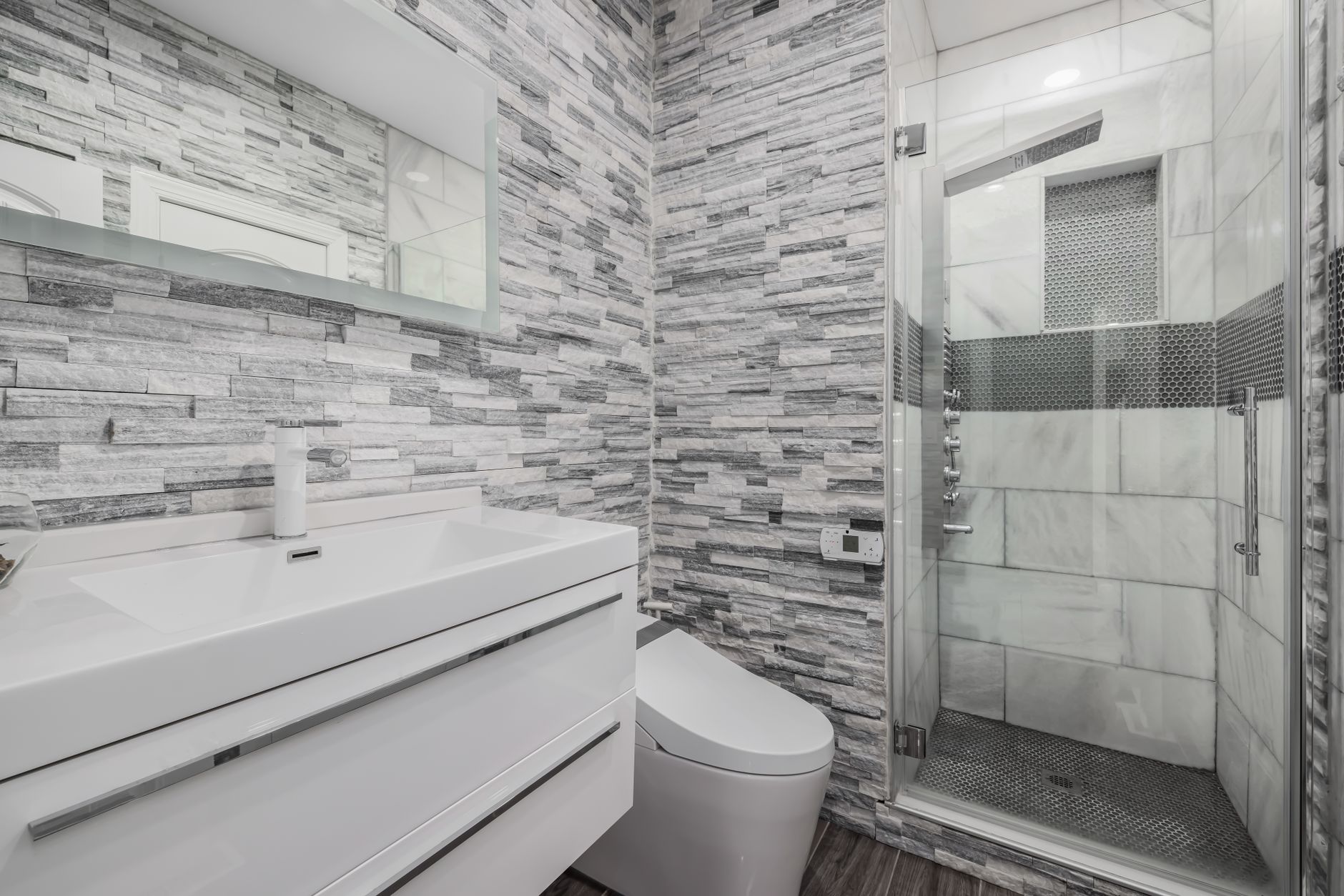 A modern bathroom with a glass shower