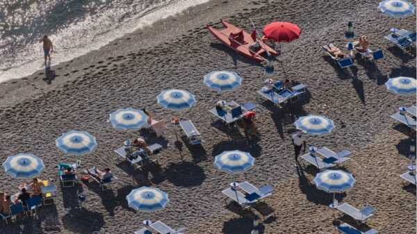 Best beach umbrella: an umbrella shading a spot on the sand