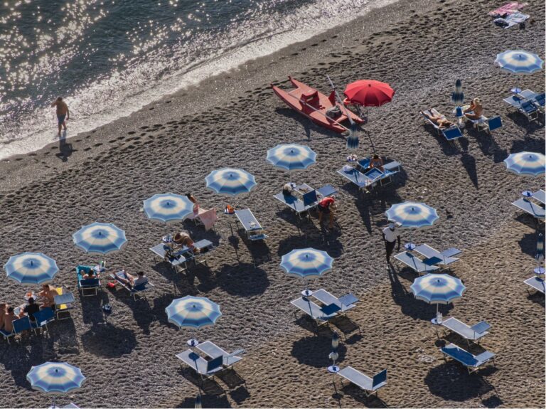 Best beach umbrella: an umbrella shading a spot on the sand