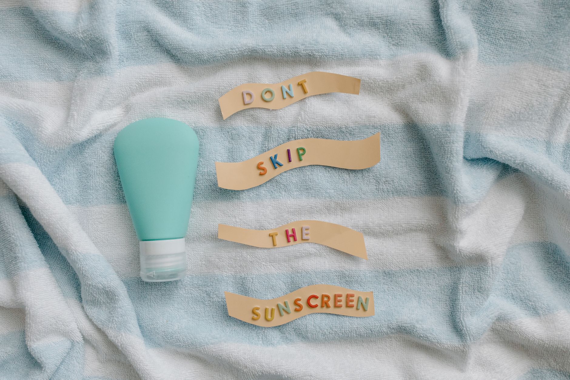 Sunscreen on a beach towel