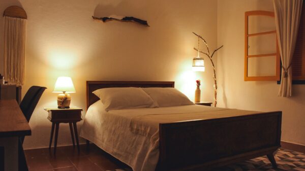 A bedroom lit by bedside lamps