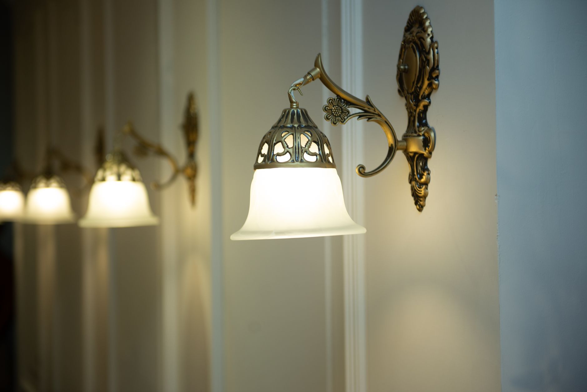 Wall sconces lighting a hallway