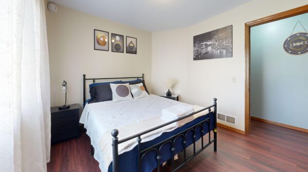 Best bed frame: a made bed in a bright bedroom
