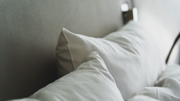 White pillows against a gray headboard