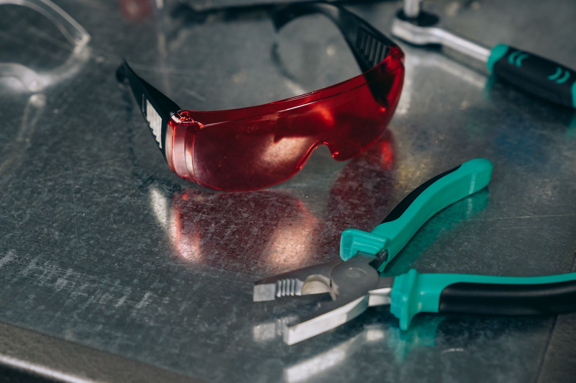 Safety glasses on a workshop bench