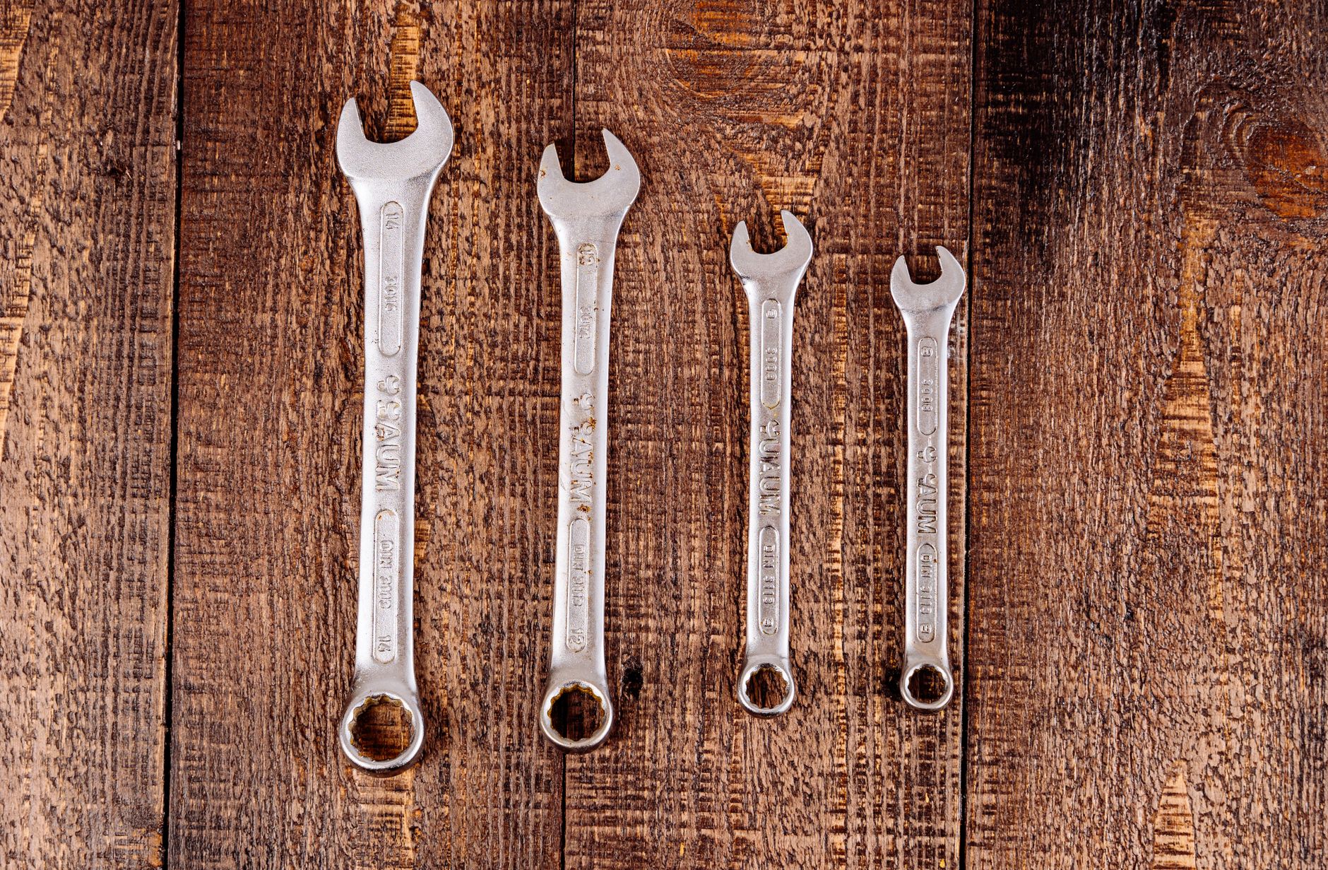 A wrench and tools for a small plumbing job