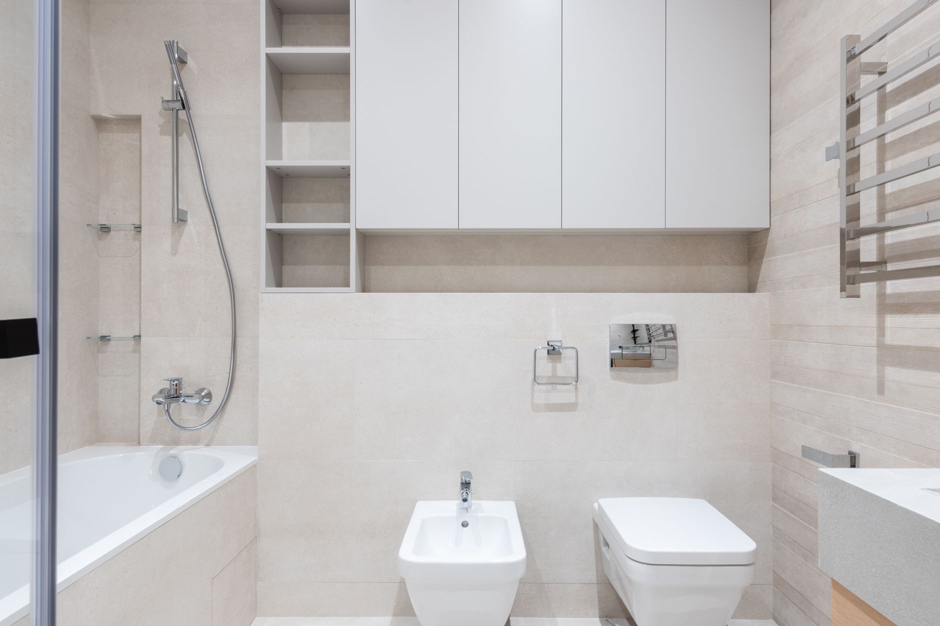A clean white bathroom with a toilet