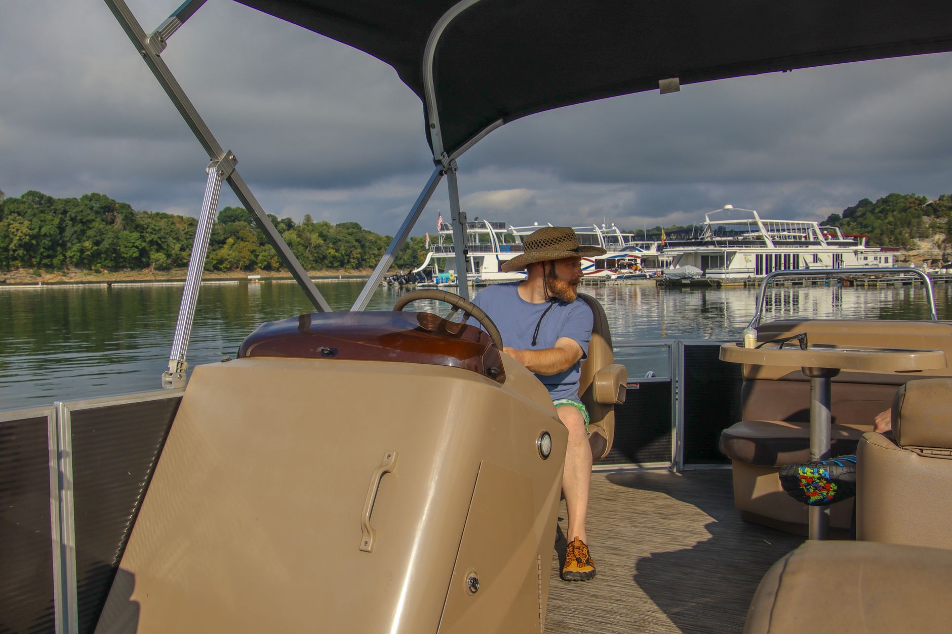 A man relaxing on a pontoon boat
