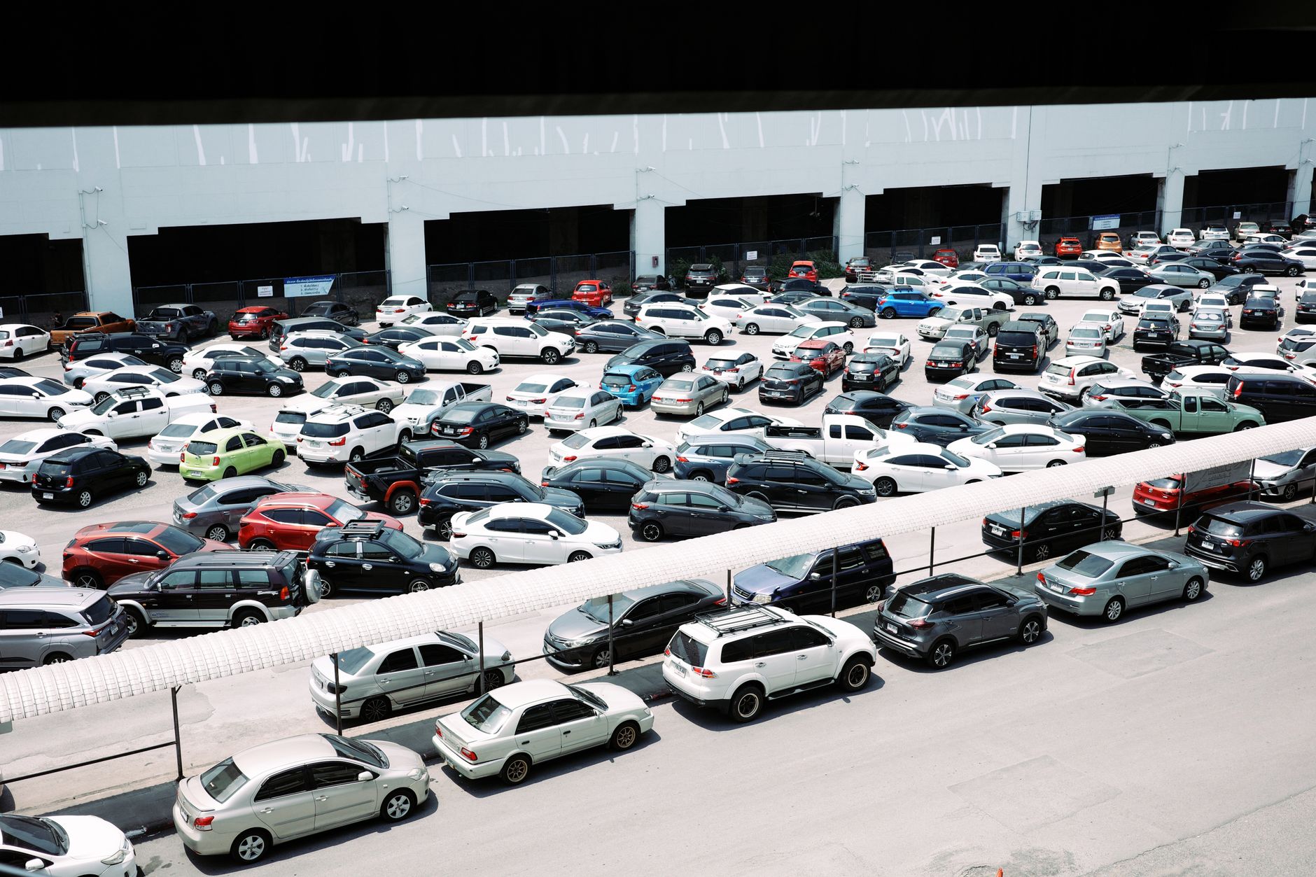 Rows of cars in a large parking lot
