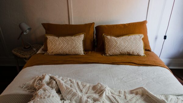 Best body pillow: pillows arranged on a made bed
