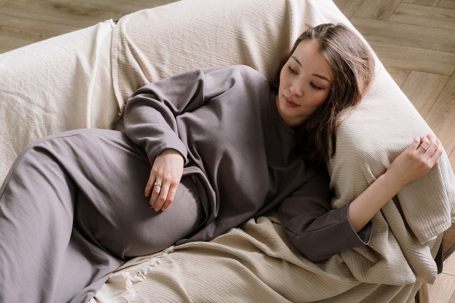 A pregnant woman resting at home