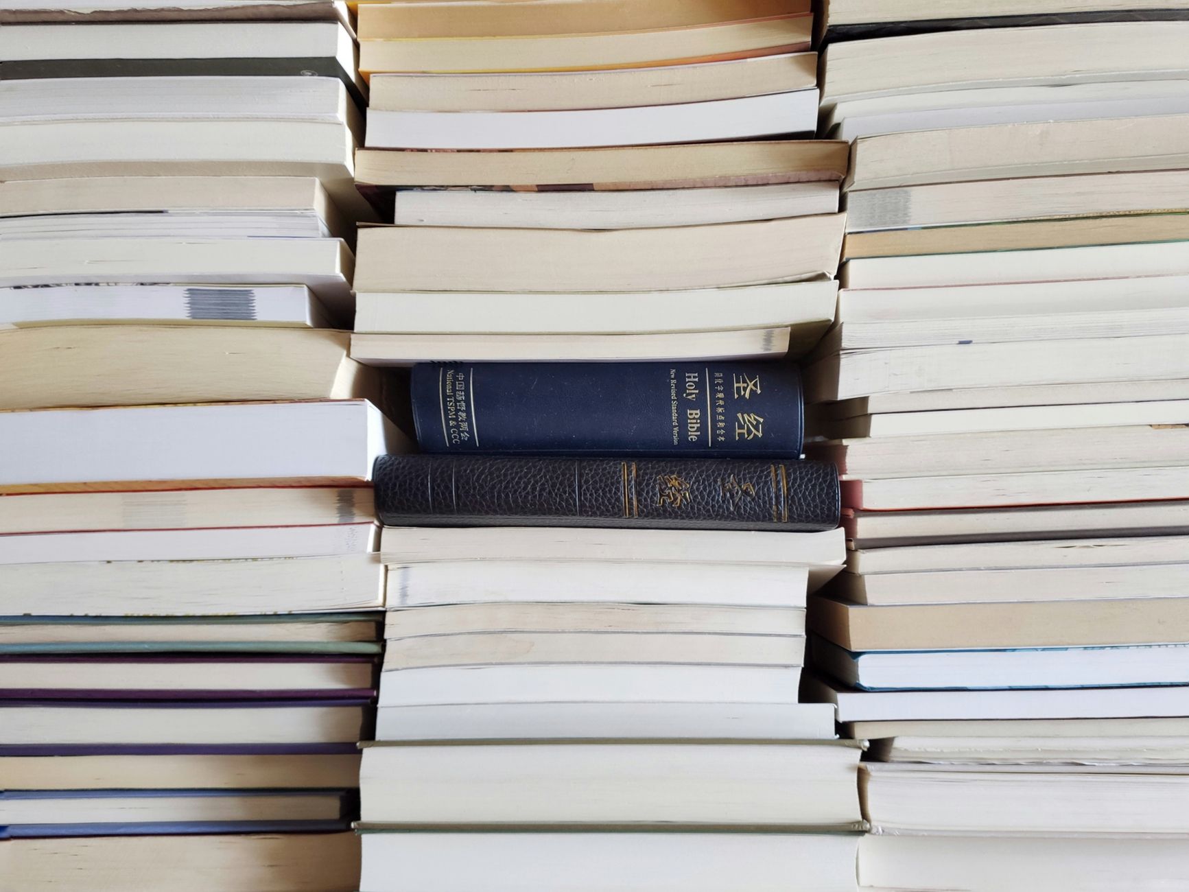 A stack of hardcover books