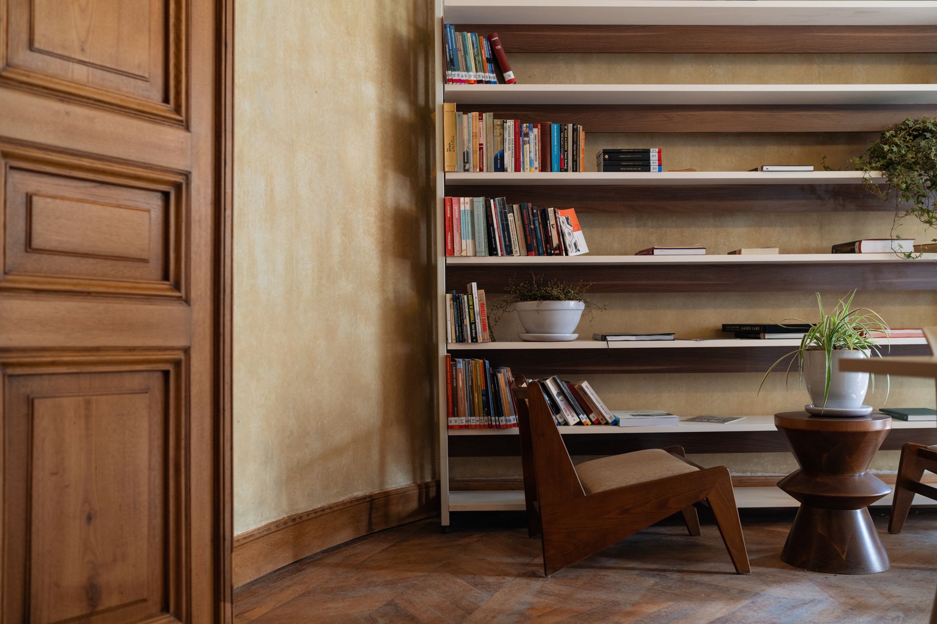 Tall shelves filled with books in a home library
